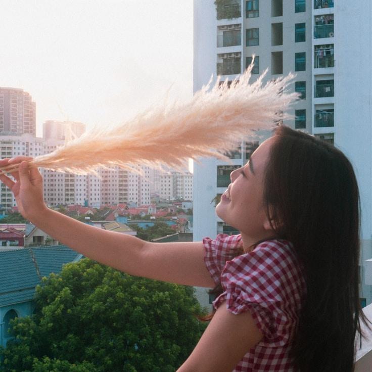 Kaveri Mehta, Lead Design Curator at Radiant Stream Framework, reviewing corporate floral arrangements